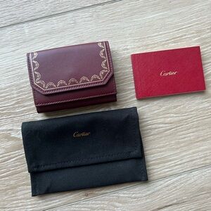 CARTIER Burgundy Leather Trifold wallet with Gold Accents